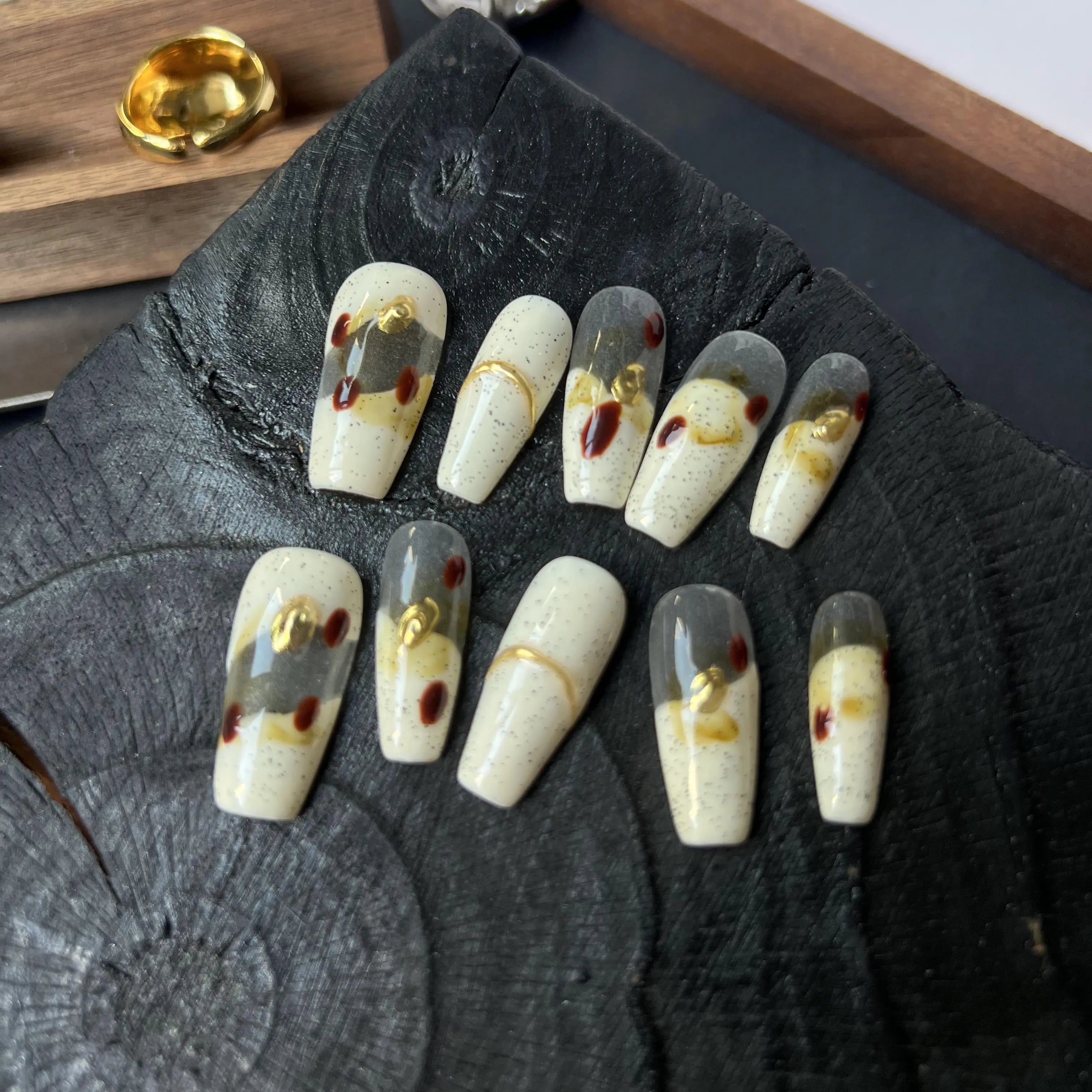 Set of decorative nail art on a wooden surface