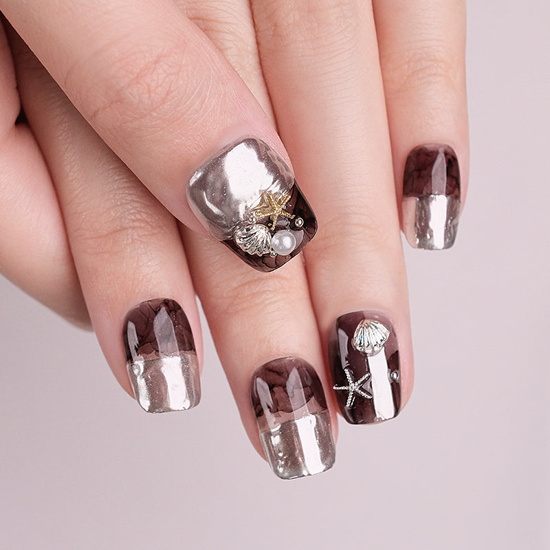Nails with decorative designs on a light background